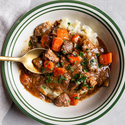 Sous vide beef bourguignon with slow-cooked beef, red wine sauce, bacon, mushrooms, and herbs.